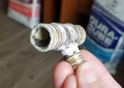 plumbing piece showing calcium and magnesium build up