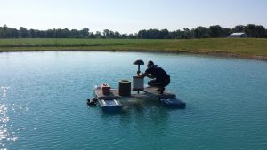 Image of technician changing a pond filter